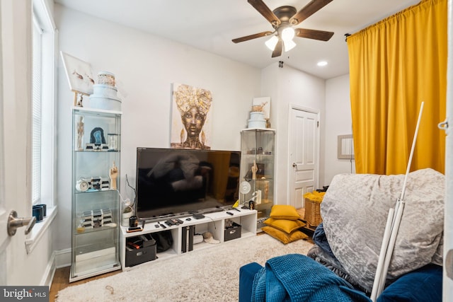 living area with recessed lighting and a ceiling fan