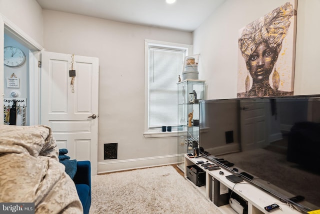 interior space featuring baseboards and visible vents