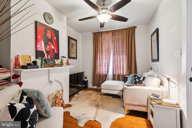 bedroom with light wood finished floors and a ceiling fan