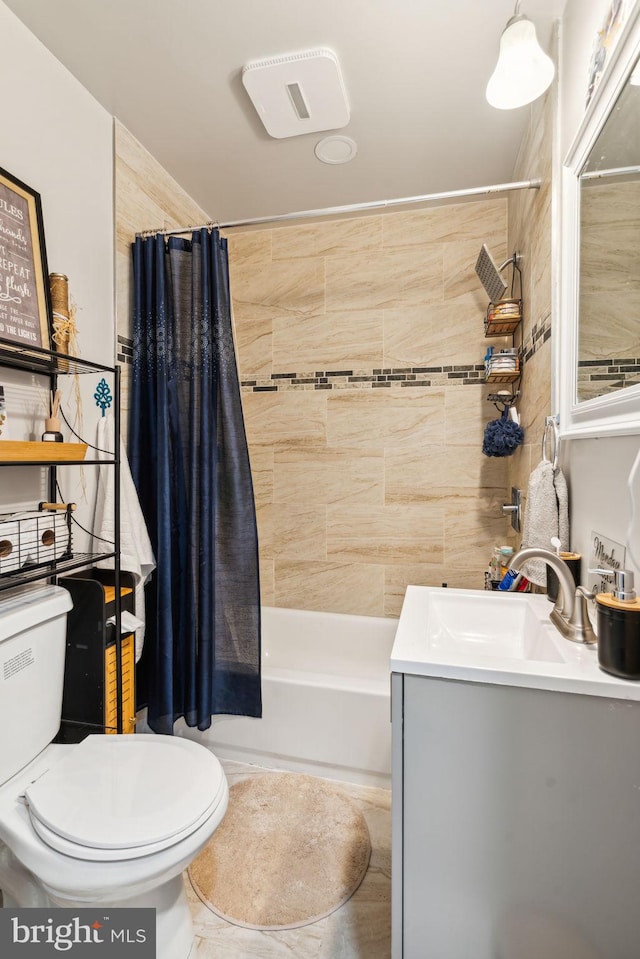 bathroom with toilet, vanity, and shower / bathtub combination with curtain