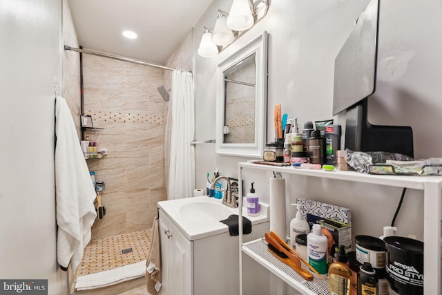 bathroom with vanity and a stall shower