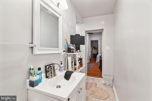 bathroom featuring vanity and baseboards