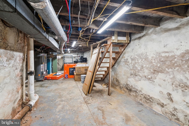 unfinished below grade area with stairway and water heater