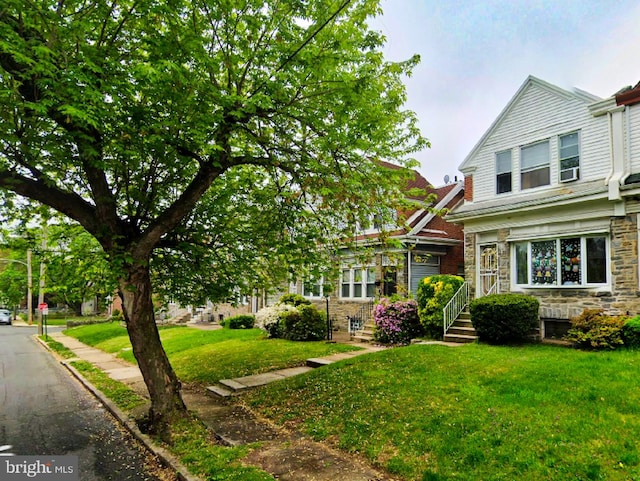 view of front of home with a front yard