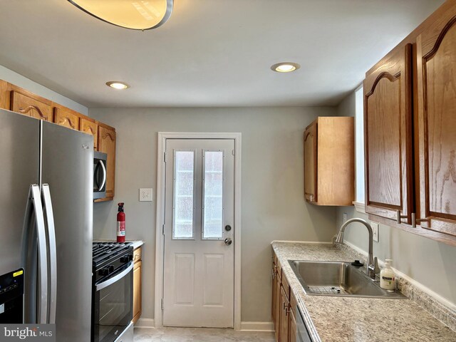 kitchen with appliances with stainless steel finishes and sink