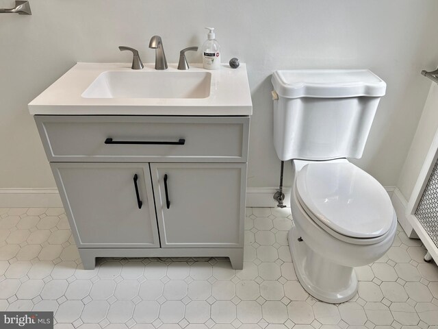 bathroom with vanity and toilet