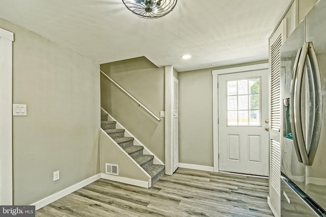 entrance foyer with light hardwood / wood-style floors