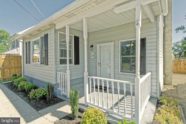 view of exterior entry with covered porch