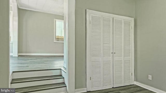 interior details featuring ornamental molding and hardwood / wood-style floors