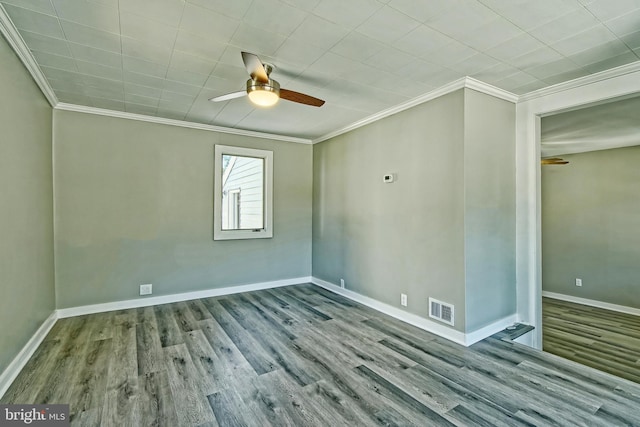 spare room with ceiling fan, hardwood / wood-style flooring, and ornamental molding