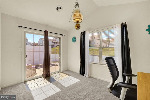 home office featuring light carpet and lofted ceiling