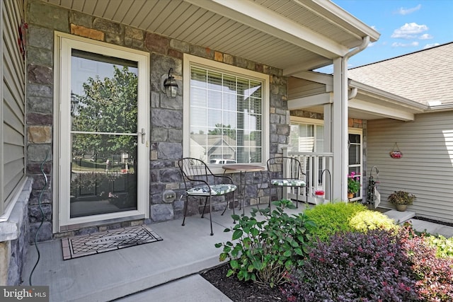 property entrance featuring covered porch