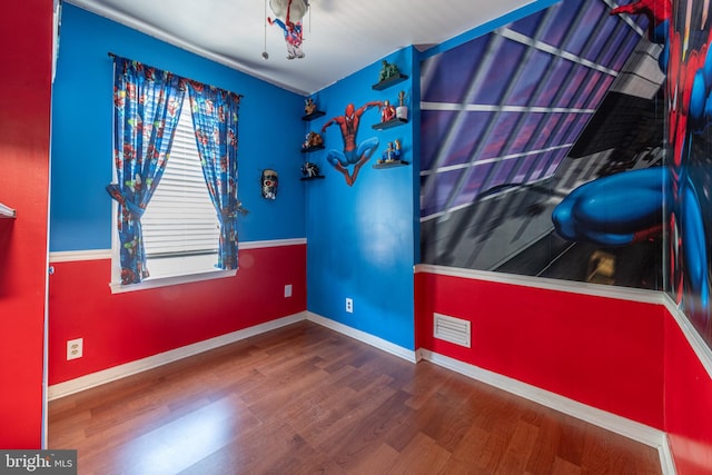 bedroom with wood-type flooring