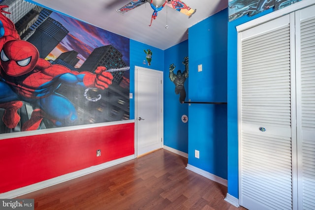 bedroom featuring wood-type flooring and ceiling fan