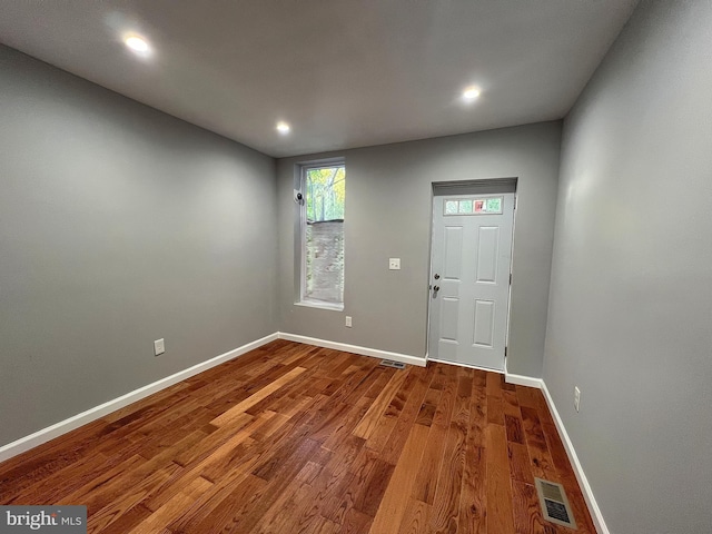 entrance foyer featuring recessed lighting, wood finished floors, visible vents, and baseboards