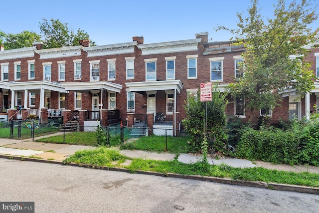 townhome / multi-family property with covered porch