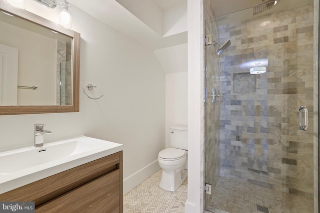 bathroom with vanity, toilet, walk in shower, and tile patterned floors