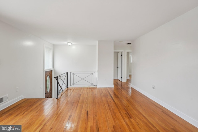 empty room featuring hardwood / wood-style floors