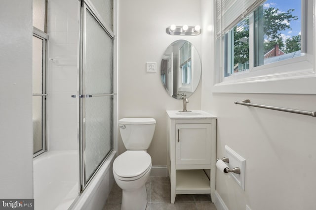 full bathroom with vanity, tile patterned flooring, toilet, and combined bath / shower with glass door