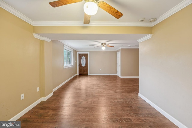 spare room featuring ornamental molding, dark hardwood / wood-style flooring, and ceiling fan