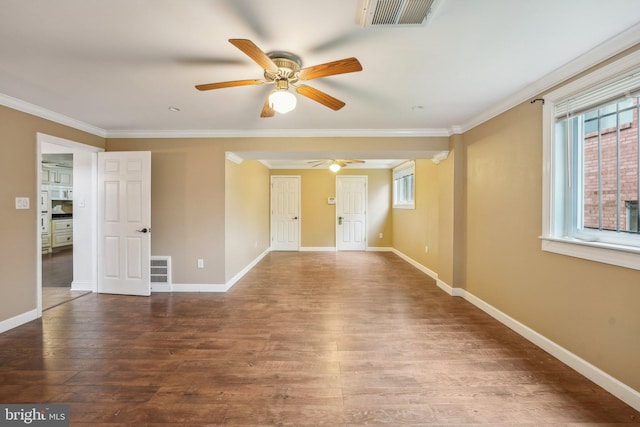 spare room with wood-type flooring, ornamental molding, and ceiling fan