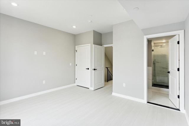 unfurnished bedroom with light wood-type flooring