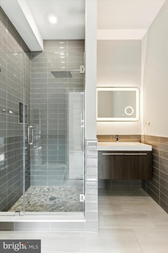 bathroom featuring vanity and walk in shower