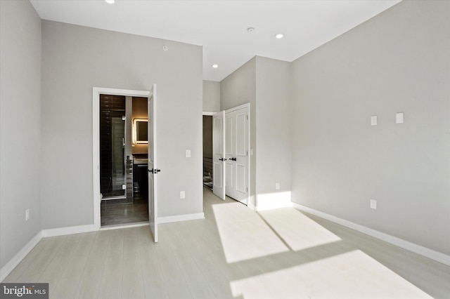 unfurnished bedroom featuring light wood-type flooring