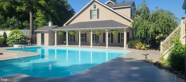 view of pool featuring a patio and ceiling fan