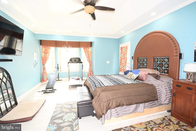 bedroom with ceiling fan and crown molding