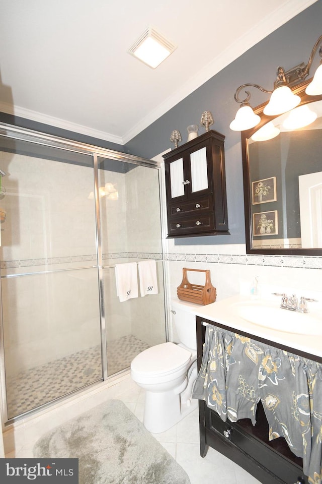 bathroom with tile patterned floors, walk in shower, ornamental molding, tile walls, and toilet