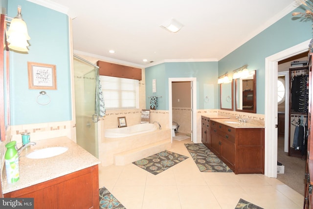 bathroom with tile patterned flooring, shower with separate bathtub, vanity, and ornamental molding