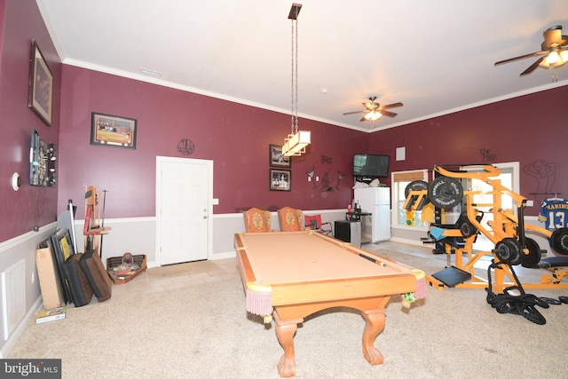 rec room featuring ceiling fan, light colored carpet, ornamental molding, and billiards