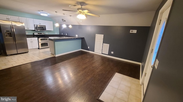 kitchen with ceiling fan, kitchen peninsula, light hardwood / wood-style floors, white cabinets, and appliances with stainless steel finishes