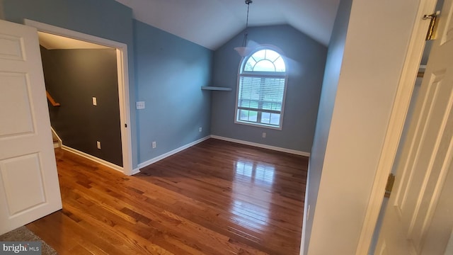 interior space with hardwood / wood-style flooring and lofted ceiling