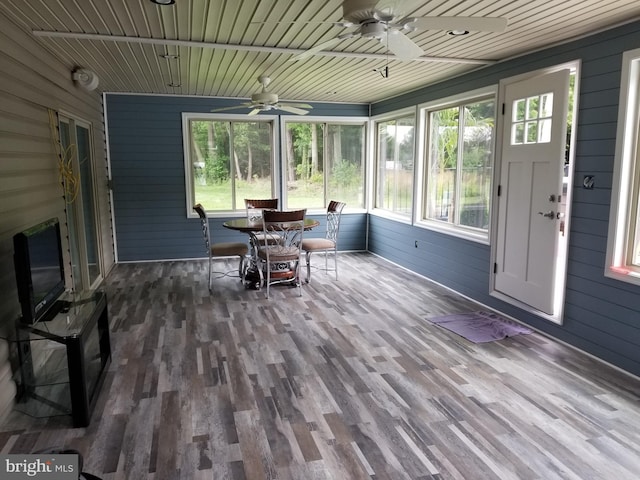 sunroom / solarium featuring wood ceiling