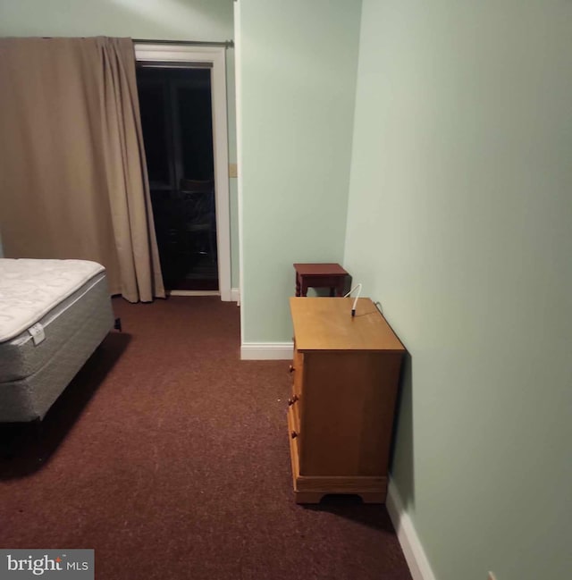 bedroom with dark carpet