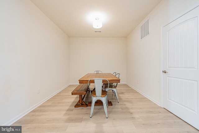 dining room with light hardwood / wood-style flooring