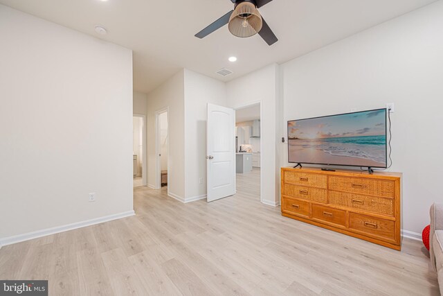 bedroom with light hardwood / wood-style floors and ceiling fan