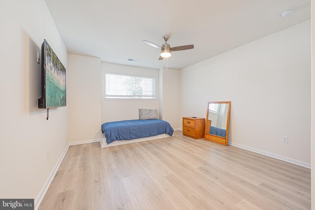 unfurnished bedroom featuring ceiling fan and light hardwood / wood-style flooring