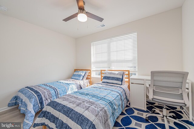 bedroom featuring ceiling fan and light hardwood / wood-style flooring