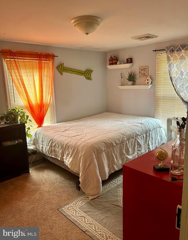 bedroom featuring carpet and visible vents