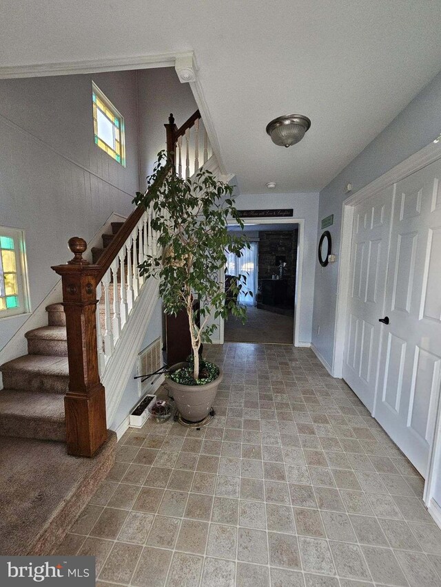 hallway featuring light tile patterned floors