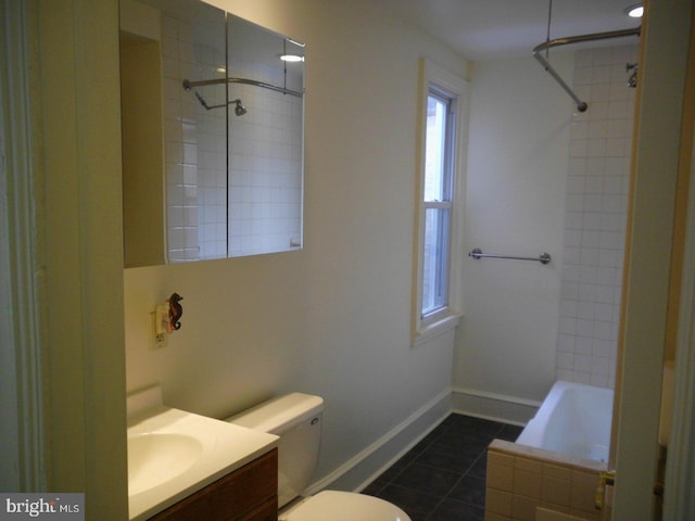 full bathroom with tile patterned flooring, vanity, toilet, and tiled shower / bath