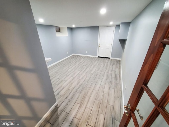 basement with light wood-type flooring