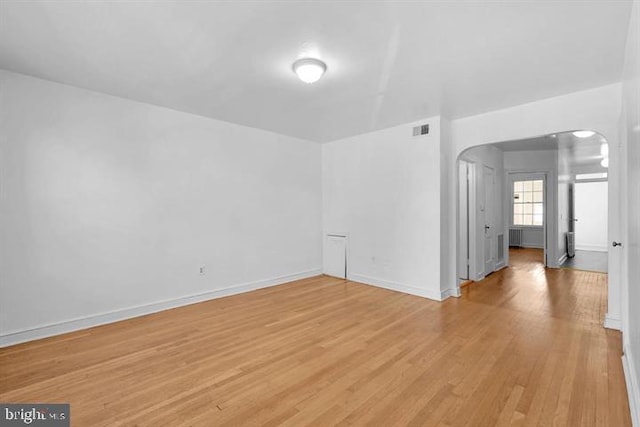 spare room featuring light wood-type flooring