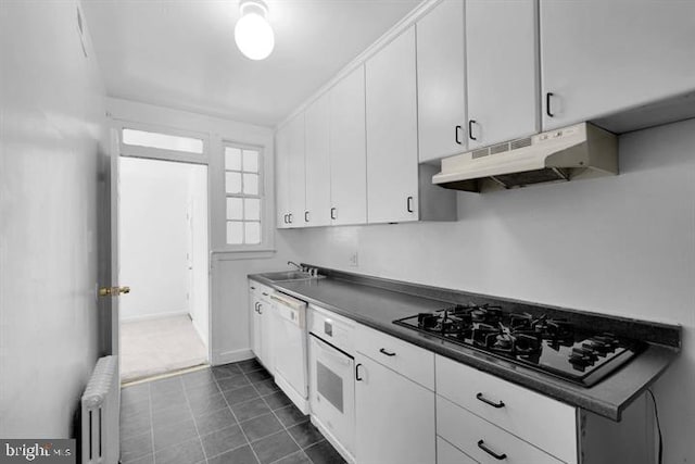 kitchen with white cabinets, white dishwasher, sink, radiator heating unit, and black gas cooktop