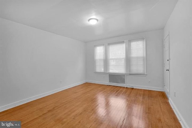 spare room featuring hardwood / wood-style floors