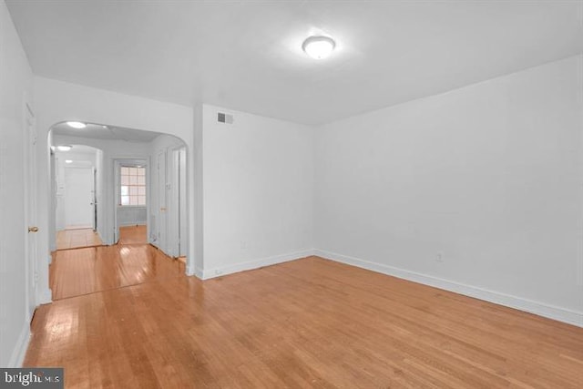 spare room with light hardwood / wood-style flooring