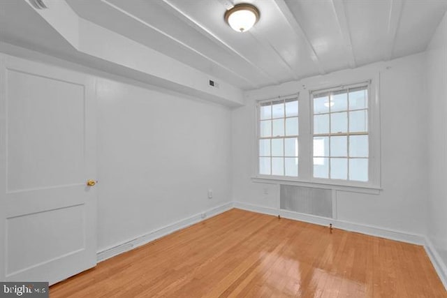 unfurnished room with light wood-type flooring